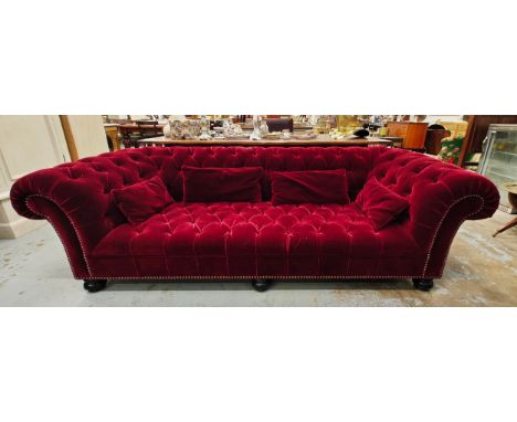 GEORGE SMITH CHESTERFIELD SOFA, in claret buttoned plush upholstery with studded detail, bears plaque, 105cm D x 2450cm L