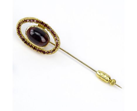 Vintage Garnet and 14 Karat Yellow Gold Stick Pin Set in the Center with an Oval  Cabochon Cut Garnet Measuring 13mm x 9mm. U