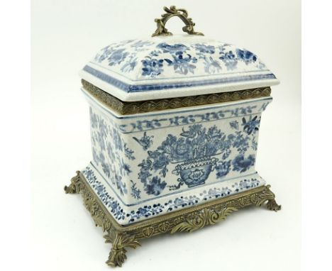 20th Century Modern Blue and White Bronze Mounted Pottery Covered Box. Unsigned. Enamel floral motif with crackle glaze finis