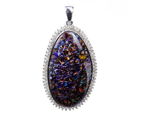 Large Black Opal and 18 Karat White Gold Pendant with Diamond Bezel. Opal measures 44mm x 24mm, good play of multi color. Sta