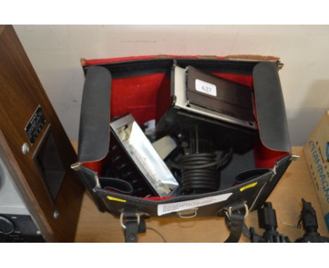 A leather case and contents of camera lights sold as collectors item