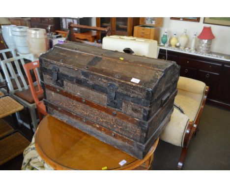 A metal bound travelling trunk 