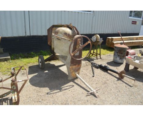 An engine powered cement mixer sold as seen