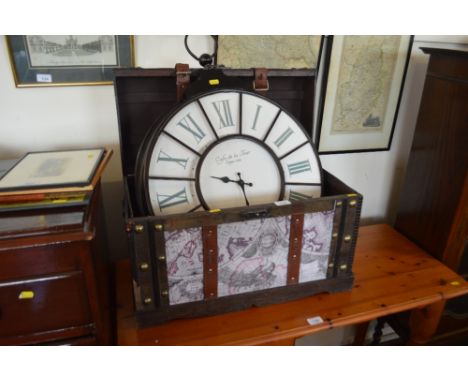 A decorative storage chest together with a wall clock