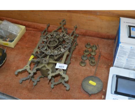 A brass skeleton clock (AF)