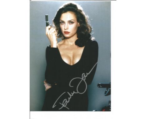 Famke Janssen 10x8 signed colour photo pictured in her role as Xenia Onatopp in the James Bond film Goldeneye. Good Condition