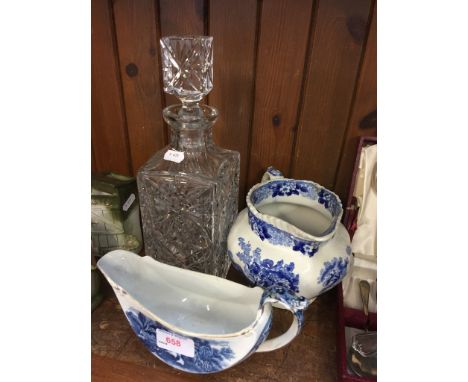 TWO BLUE AND WHITE JUGS AND A GLASS DECANTER