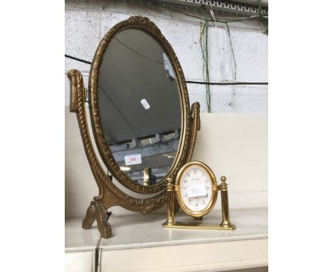 A DRESSING TABLE MIRROR AND A CLOCK   F5