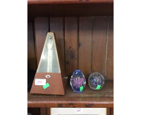 METRONOME AND TWO GLASS PAPERWEIGHTS