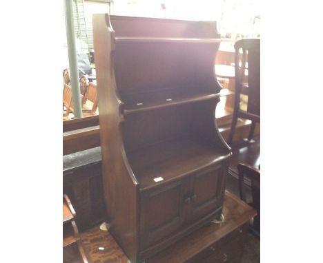 AN ERCOL STEPPED BOOKCASE UNIT   H111CM W61CM D35CM