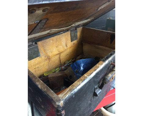 AN OLD TOOL BOX WITH TOOLS