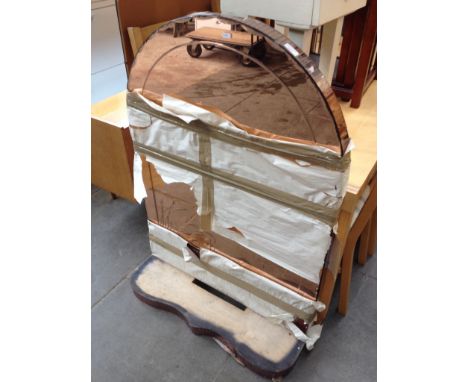 AN ART DECO ARCHED MIRROR WITH LOWER SHELF
