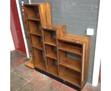 A ART DECO STYLE ROSEWOOD VENEERED STEPPED BOOKCASE H142CM W115CM D28CMCONDITION: SOME CHIPS AND LOSS TO VENEER IN PLACES, SE
