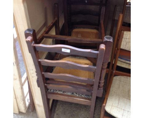 A SET OF FOUR LADDER BACK CHAIRS