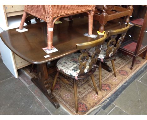 AN ERCOL ELM DINING TABLE AND 6 CHAIRS    (TABLE LENGTH 153CM WIDTH 73CM)