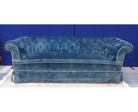 Three seater button back Chesterfield style sofa with mahogany turned supports upholstered in blue velvet. Provenance Rita Tu