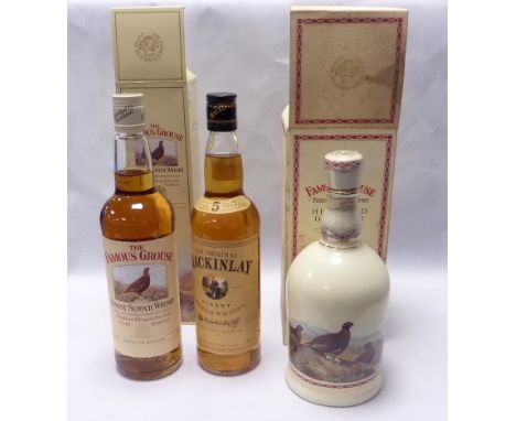 A bottle and decanter of "The Famous Grouse" Scotch Whisky 70cl, both boxed, also a bottle of "The Original Mackinlay" 70cl. 