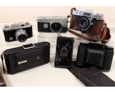 Collection of various vintage cameras - Zeiss Ikon, Super Ikonta, Ikonta, Olympus Pen F Kodak Vest Pocket and Halina 35X. (6)