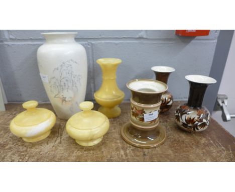 A Poole Pottery Birds of Paradise vase, a yellow soapstone dressing table set and three pieces of Jersey pottery 