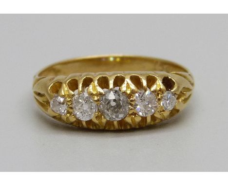 An 18ct gold, five stone diamond ring, 3g, K 