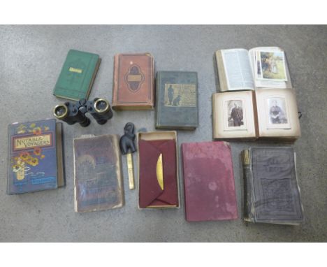 A collection of books, a pair of military binoculars marked Kershaw 1943, a lighter, etc. 