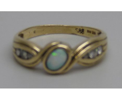 A 14k gold, opal and white stone ring, 2.9g, Q 