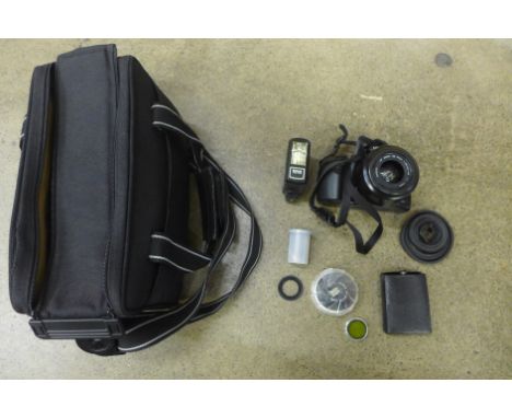 A Minolta Dynax 500si SLR camera, with flash, filters, extension tube and instructions 