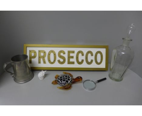 Assorted items; a glass decanter, pewter tankard, art glass turtle, magnifying glass, a Danish figure of a mouse and Prosecco