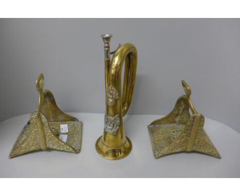 A bugle, a car horn and a pair of brass stirrups 