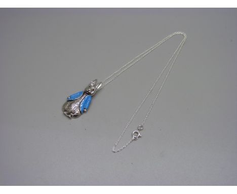 A silver and enamel Peter Rabbit pendant and chain 