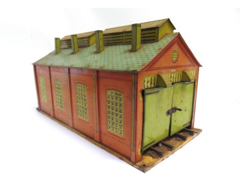 [O GAUGE]. HORNBY LINESIDE ACCESSORIES  comprising a two-road (two-rail) engine shed; and a station, 'Windsor', with green pl