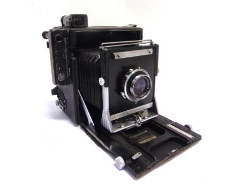 A GRAFLEX SPEED GRAPHIC PRESS CAMERA  with a Schneider-Kreuznach Xenar 1:4.7 135mm lens, no.2558927, a Compur-Rapid shutter, 