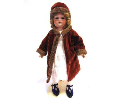 A SIMON &amp; HALBIG FOR KAMMER &amp; REINHARDT BISQUE SOCKET HEAD DOLL  with a long, curled light brown wig, sleeping brown 