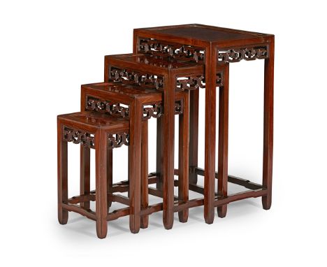 SET OF CHINESE WALNUT AND BURRWOOD QUARTETTO TABLES  EARLY 20TH CENTURY   the panel tops over scroll carved and pierced apron