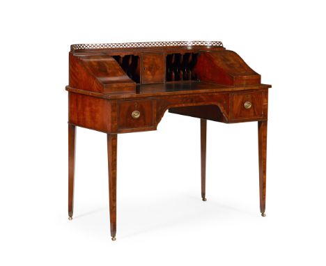 LATE GEORGIAN MAHOGANY AND WALNUT CARLTON HOUSE DESK  EARLY 19TH CENTURY   the superstructure with a pierced gallery above an