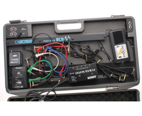 Boss BCB-60 guitar effects pedal board, including an Arion PS-05 power supply, a Line 6 Relay G30 wireless guitar system and 