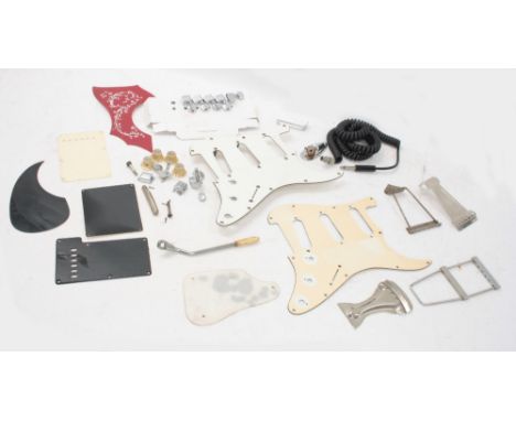 Selection of guitar spares to include an incomplete set of five Fender guitar tuners, two Strat scratchplates, tailpieces, ot
