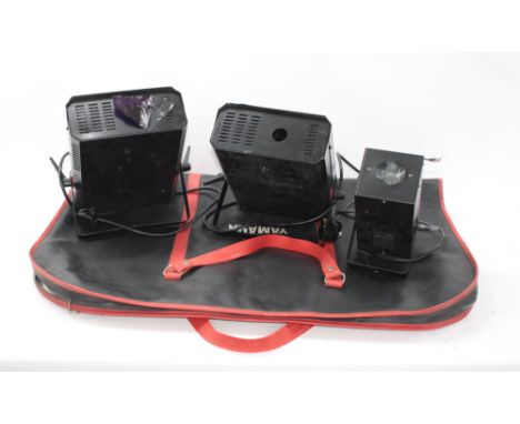 Two Show Tec stage lights; together with a Skytec stage light within a Yamaha carry-case