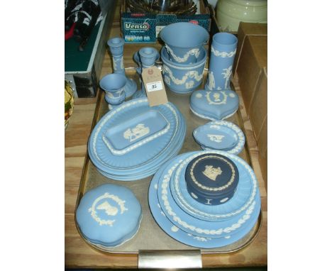 A Collection of Wedgwood blue and white jasperware items including assorted vases, pair of candlesticks, oval and circular pl