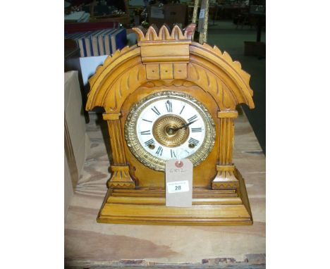 An American Ansonia Victorian mantel clock with a gilt metal and enamelled dial and a two train movement.