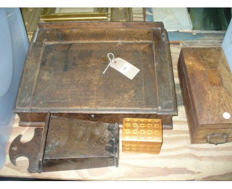 An Oak hinged writing slope, a 19th century sarcophagus shaped tea caddy, a 19th century oak candle box and 1 other.(4)