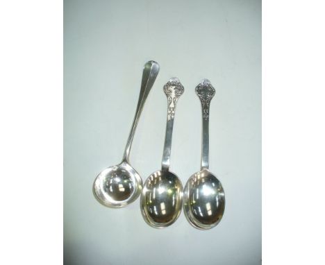 A Silver rats tail ladle, Sheffield 1902 and a pair of silver serving spoons with trefoil terminals, the bowls embossed with 