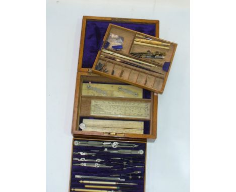 A Brass embellished oak cased geometry set with 2 removable trays.