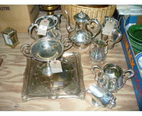 A Qty of plated ware including a coffee pot with a fruit finial, milk jug and 2 handled sugar basin on scroll feet, sugar hel