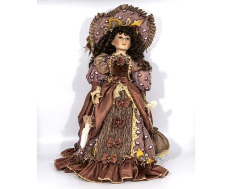 Large standing doll dressed in elegant clothing wearing a large hat, bisque head and hands. 24"high   