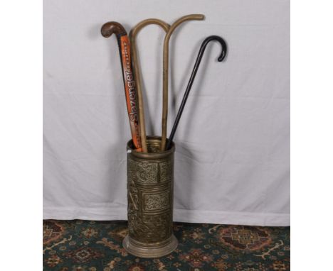 A brass stick stand and walking canes