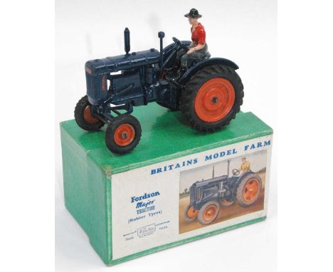 A Britains model farm series No. 128F Fordson Major tractor in blue with orange hubs and rubber tyres, complete with farm fig