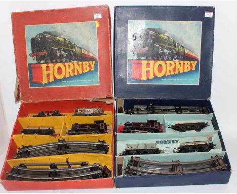 Two Hornby 'O' sets: 1954-8 No 40 tank goods comprising 0-4-0 c/w BR82011 loco (G) wih 3 wagons, track, key (G-BG) and 1957-6
