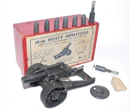 A Britains set No. 2 18" heavy howitzer mounted on tractor wheels for field operation, finished in dark grey fumed metal fini