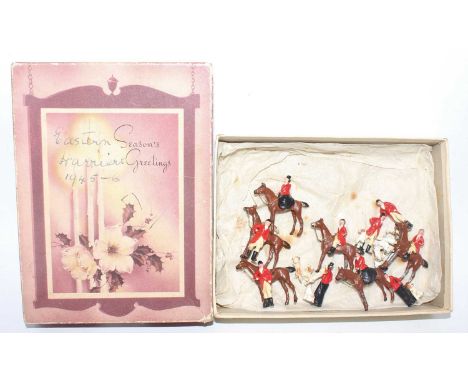 A Britains miniature series lead and hollow cast hunting &amp; hounds figure group to include huntswoman mounted side-saddle,